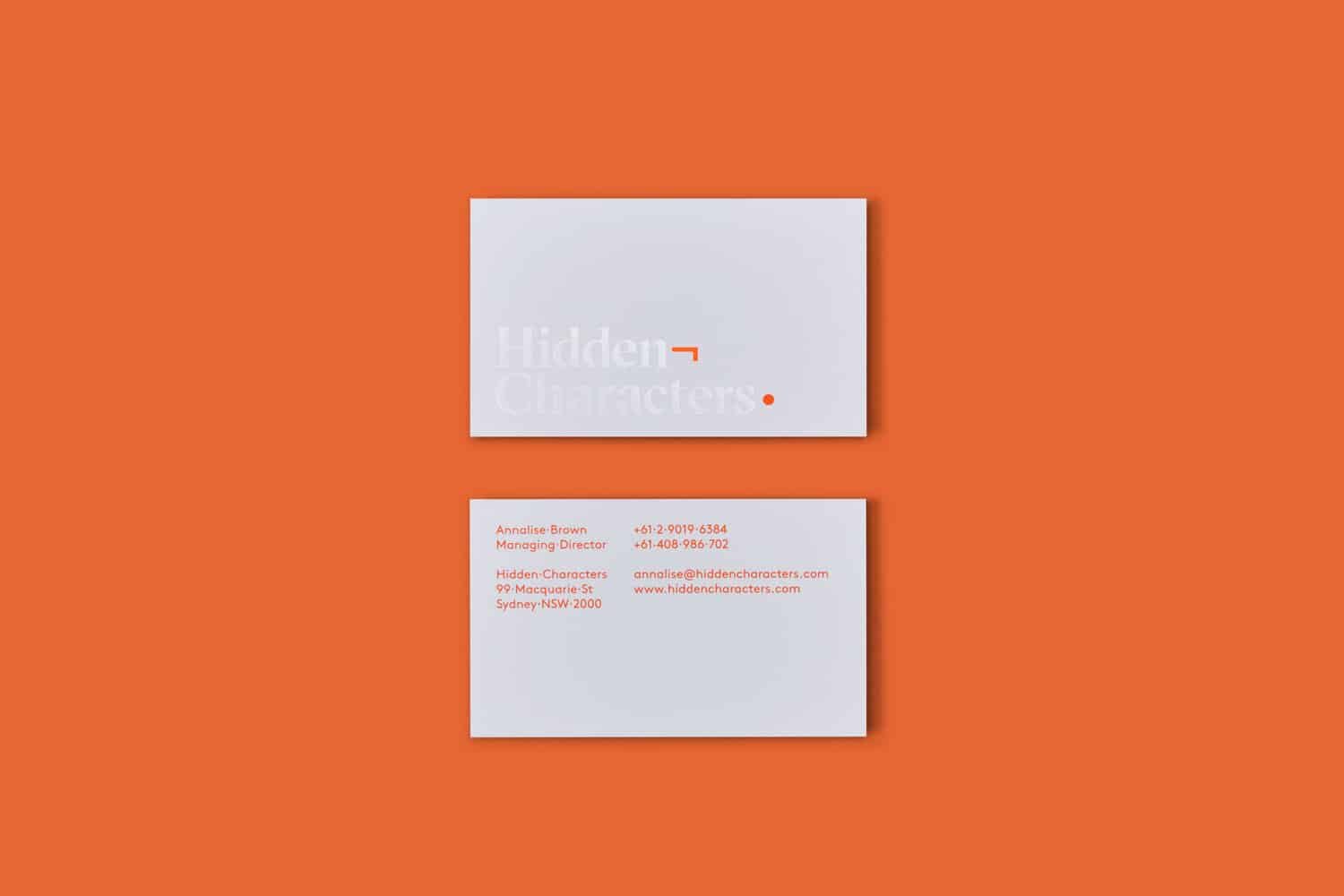 hidden characters, business cards, orange branding