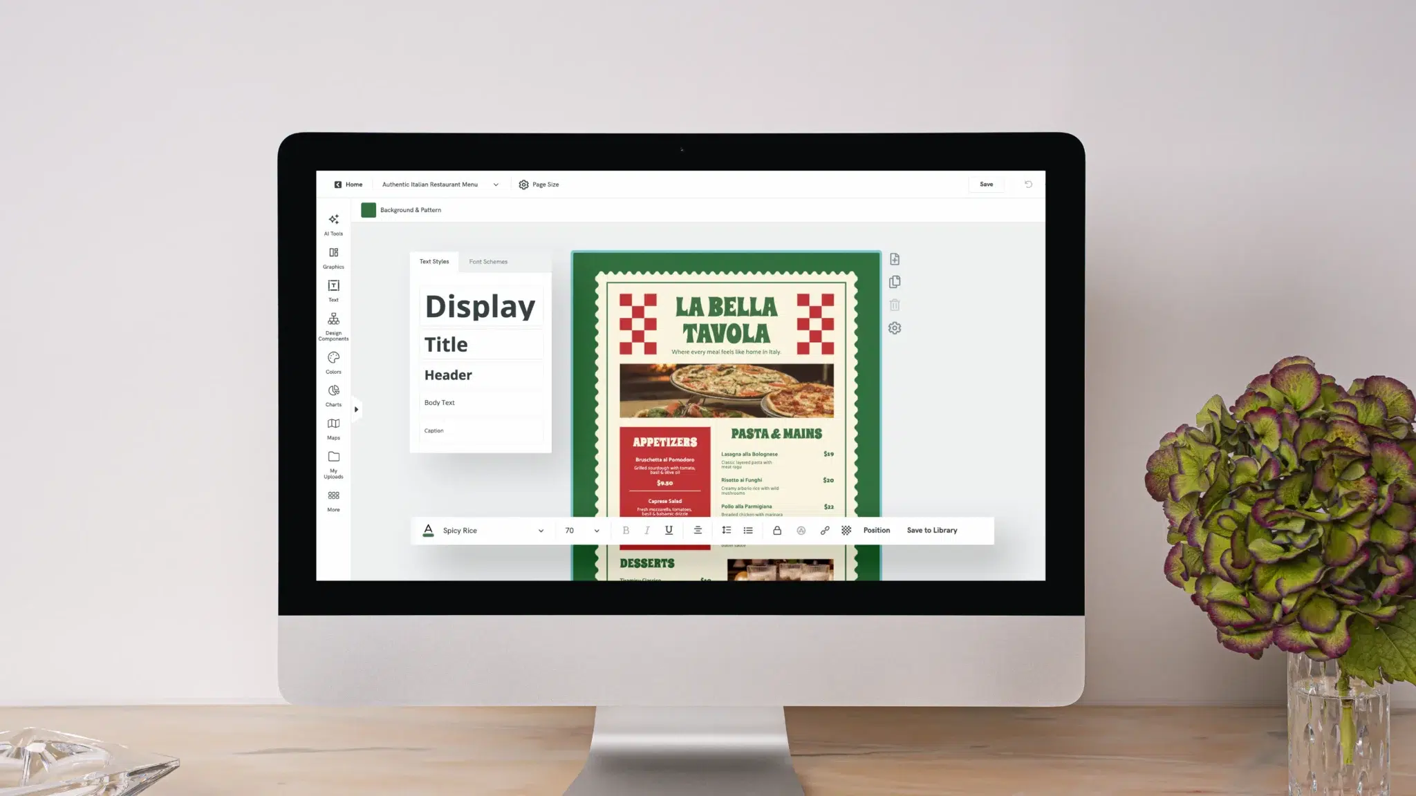 a laptop computer open on a desk displaying a restaurant menu editor, the menu for the grove cafe is partially covered by a breakfast and bowls pop up menu, pencils and notebooks are arranged on the desk near the computer